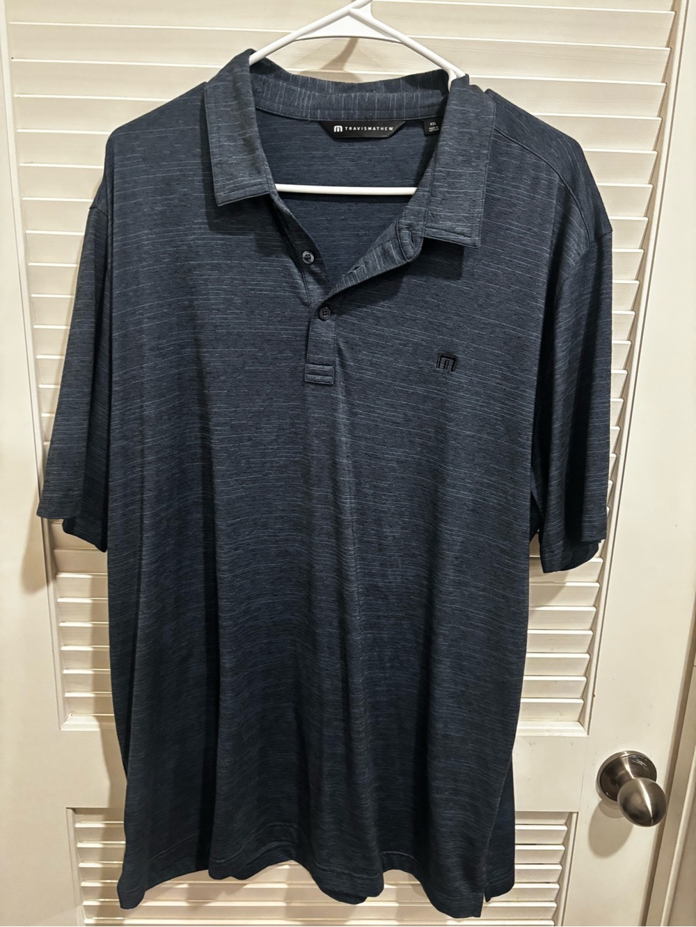 Travis Mathew Men's Heathered Dark Navy Polo